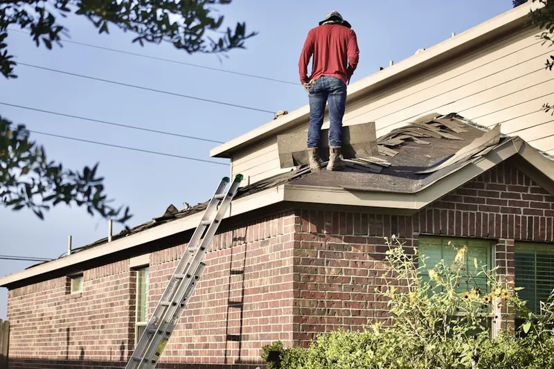 Professional roofer working on a residential roof in Seeneytown